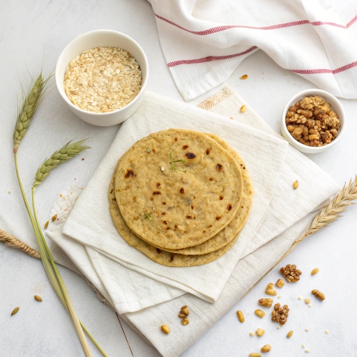 Light brown oats roti, soft and pliable, served with mixed vegetable sabzi